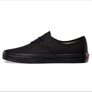 Vans low tops. Black with black laces.
